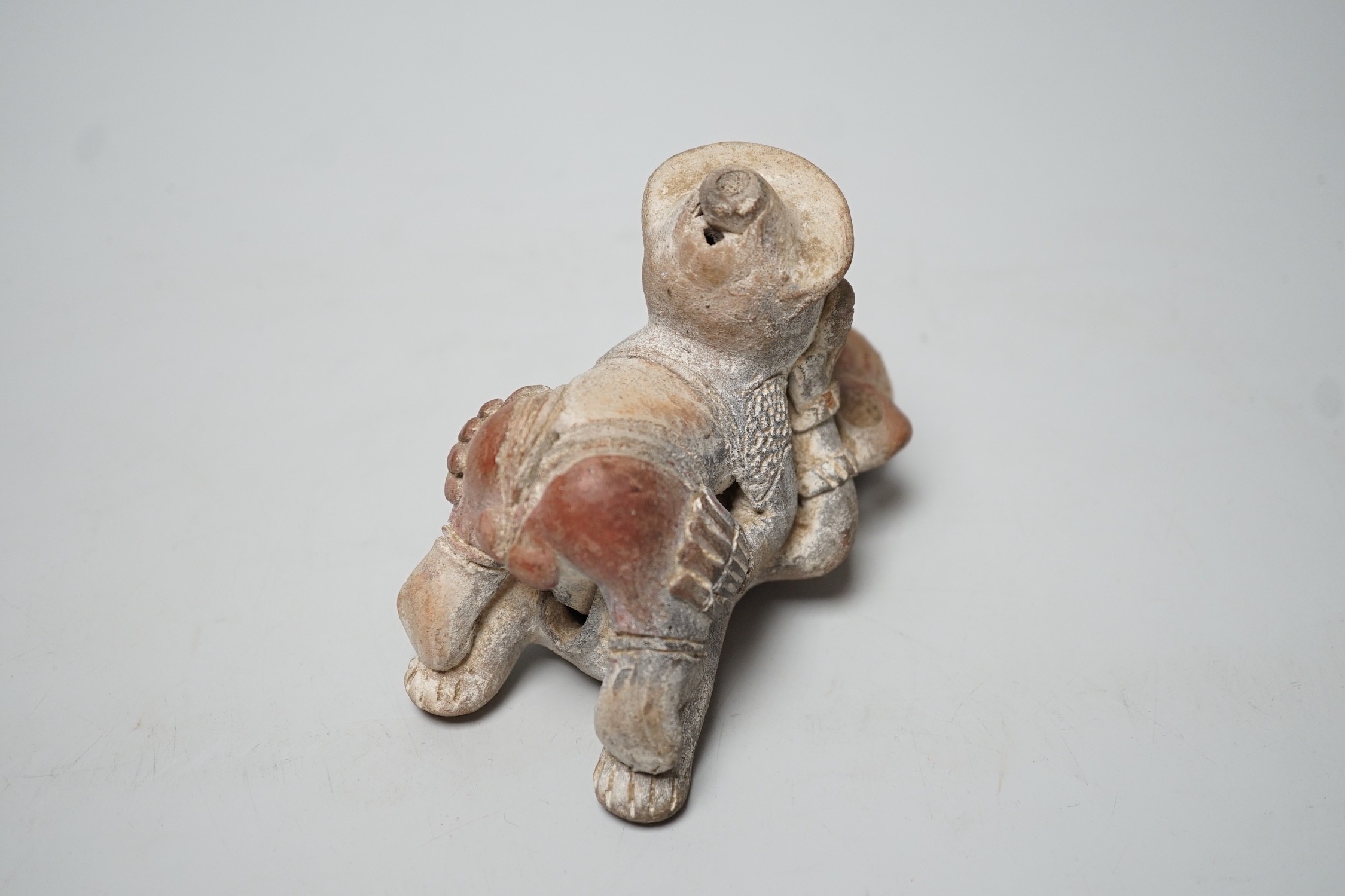 A Mayan or later biscuit earthenware erotic novelty whistle, 12cm long